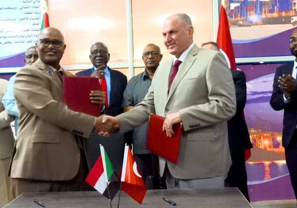 Director General of the Sudan's Sea Ports Corporation shakes hands with Turkish company Ergaz CEO after signing a gaz terminal in Suakin on July 15, 2026