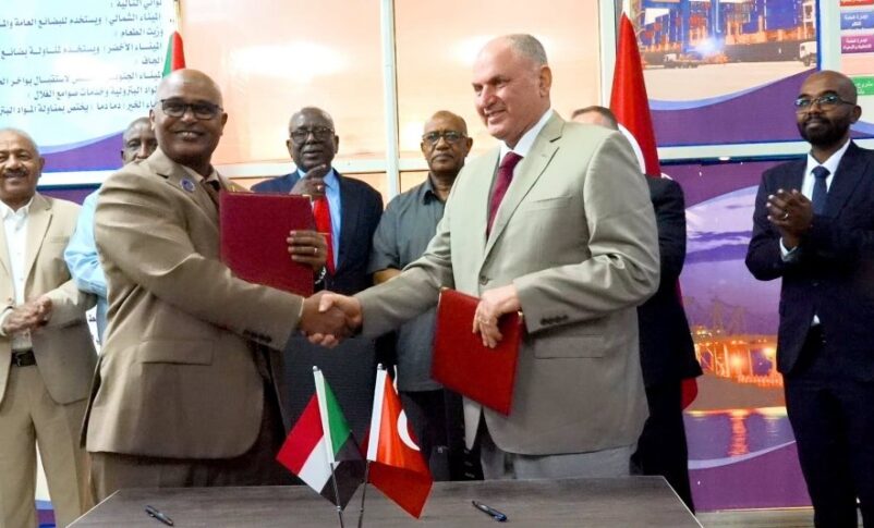 Director General of the Sudan's Sea Ports Corporation shakes hands with Turkish company Ergaz CEO after signing a gaz terminal in Suakin on July 15, 2026