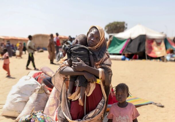 On 16 February, 2026 Halima with her youngest two-year-old son Samsadeen and four-year-old Intenan, upon arrival at Goz Alsalam IDP site in White Nile State. UNICEF photo