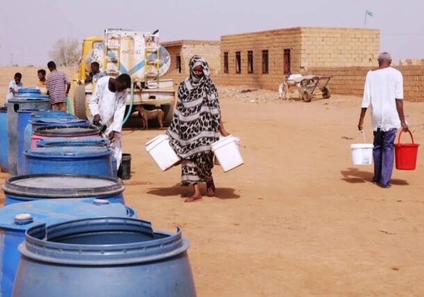 People fill water containers at a free distribution point amid water outages in Khartoum, Sudan, May 18, 2026. AP photo