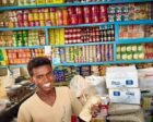 Sudanese trader holds apile of Sudanese pound banknotes in his shop in Port Sudan, on June 22, 2026 , Photo Adrian Sameli