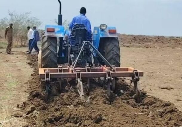 A farmer operates a tractor to till agricultural land in Sennar State, Sudan, on July 26, 2026.