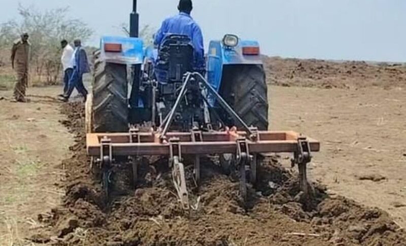 A farmer operates a tractor to till agricultural land in Sennar State, Sudan, on July 26, 2026.