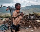 A member of the Afar Special Forces in front of the debris of a house in Tigray Region on December 9, 2020 AFP photo