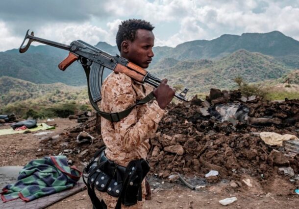 A member of the Afar Special Forces in front of the debris of a house in Tigray Region on December 9, 2020 AFP photo