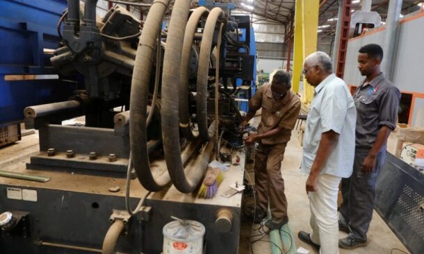 Industrial workers repair a production line at an electrical appliances factory in the Bahri area of Khartoum. October 15, 2025. Reuters photo