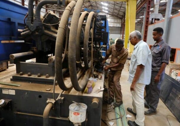 Industrial workers repair a production line at an electrical appliances factory in the Bahri area of Khartoum. October 15, 2025. Reuters photo