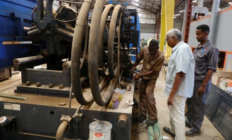 Industrial workers repair a production line at an electrical appliances factory in the Bahri area of Khartoum. October 15, 2025. Reuters photo
