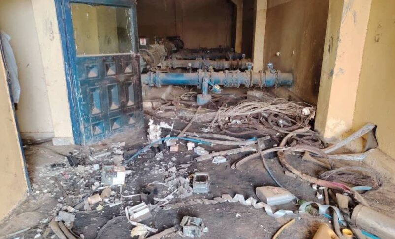 Interior of an abandoned water station with damaged infrastructure and a littered floor in Bara, North Kordofan, Sudan.