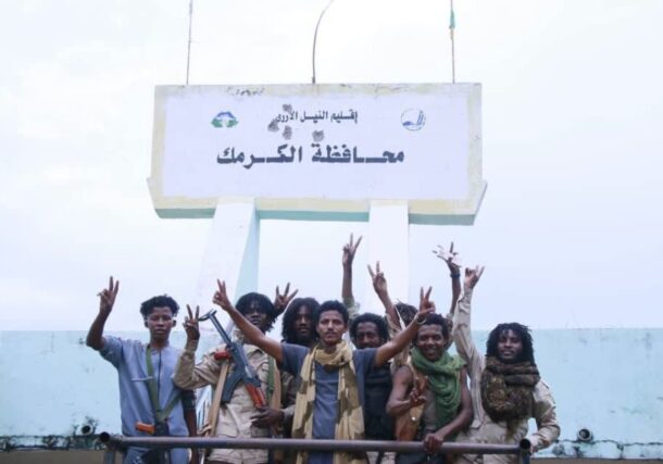 RSF fighters pose outside Kurmuk district headquarters on August 13, 2026