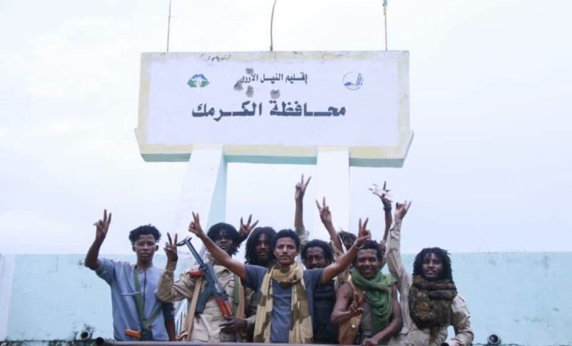 RSF fighters pose outside Kurmuk district headquarters on August 13, 2026