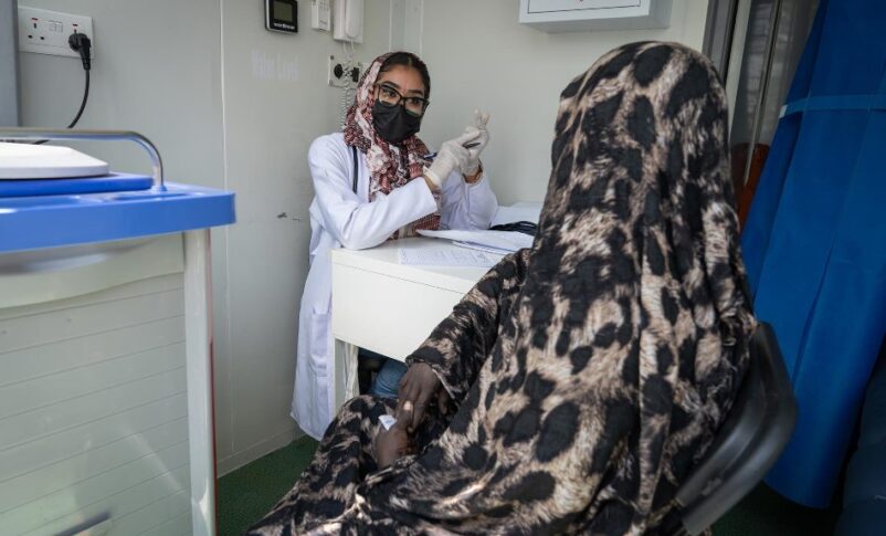 A Sudanese health worker counsels a woman living with HIV after distributing antiretroviral medication, April 2, 2025. UNDP Photo