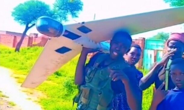 Sudanese soldiers display a downed drone in Dilling, South Kordofan, on August 7, 2026.