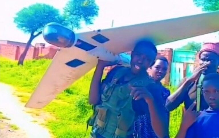 Sudanese soldiers display a downed drone in Dilling, South Kordofan, on August 7, 2026.