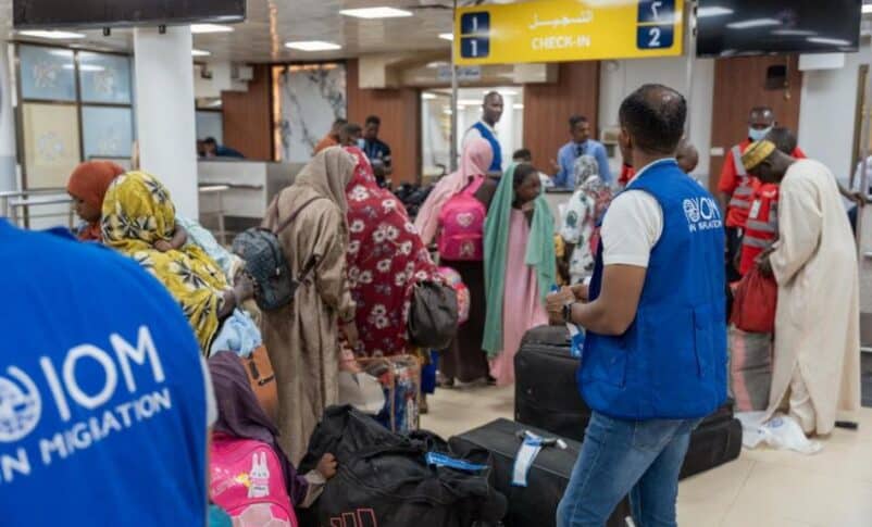 Beneficiaries of the IOM's Assisted Voluntary Return Programme wait to check in for the first voluntary return flight at Khartoum Airport, on September 3, 2026. IOM photo