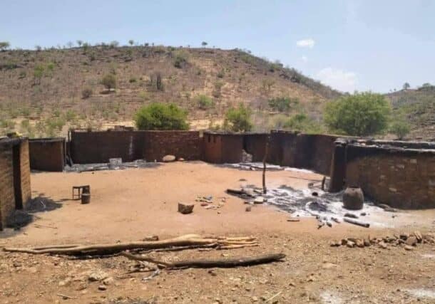 Burned homes in Kauda after deadly clashes in May 2026