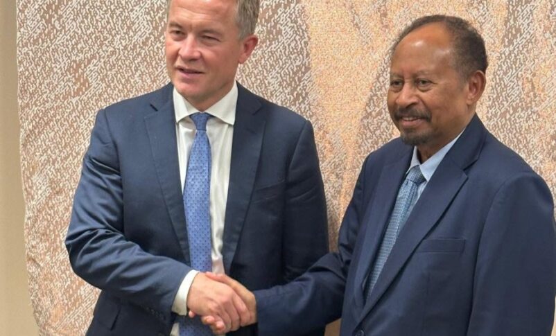 Former prime minister Abdalla Hamdok, shakes hands with Norwegian State Secretary Andreas Kravik in New York on Sept 22, 2026