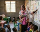 Sudanese volunteer KhadmAlla Musa Abdelghani teaches young children in a makeshift classroom in Khartoum Bahri, in an undated file photograph.