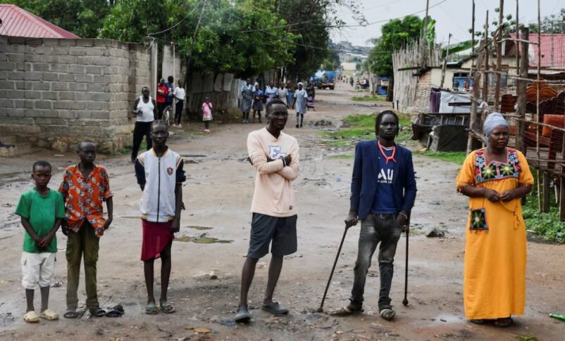 People stand outside their homes following a night of gunfire after security forces moved to arrest the former head of the intelligence service, in Juba, November 22, 2024. Reuters photo