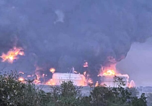 Smoke rises from burning storage tanks at the Um Aleila fuel depot following a drone strike by the paramilitary RSF, near Wad Madani, Al Jazirah state, Sept 27, 2026.