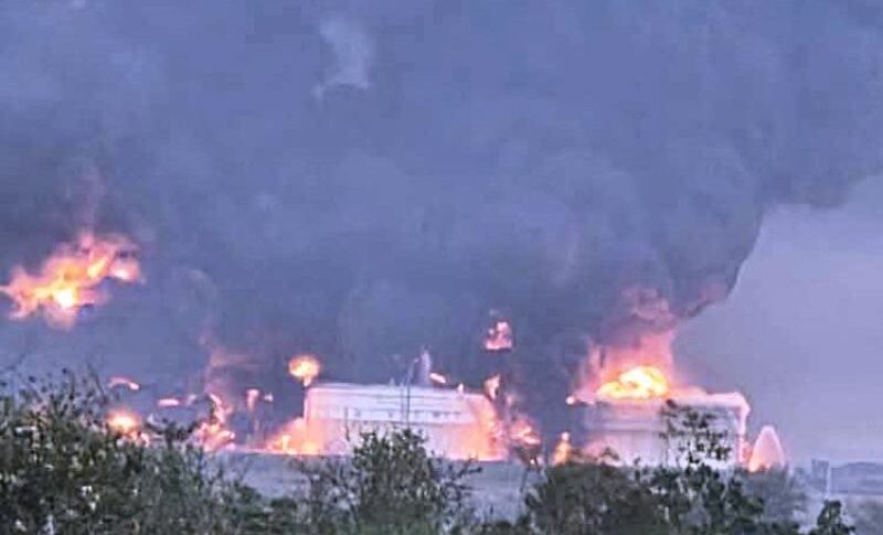 Smoke rises from burning storage tanks at the Um Aleila fuel depot following a drone strike by the paramilitary RSF, near Wad Madani, Al Jazirah state, Sept 27, 2026.