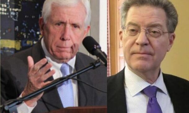 former U.S. Representative Frank Wolf (L) and former Ambassador Sam Brownback