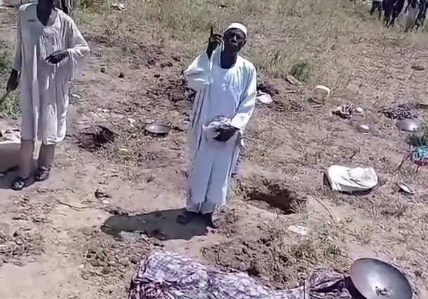 A survivor speaks near the site of an alleged RSF drone strike that killed 30 displaced people at a shelter in Wad al-Mahi, Blue Nile region, October 9, 2026.+