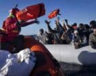 African migrants on a makeshift rubber boat receive life jackets from a Spanish NGO off the Libyan coast, Jan. 28, 2022.AP photo