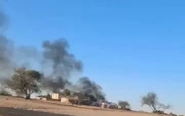Smoke rises from burning buildings following a drone attack in the Bamna area of Chad, Oct. 20, 2026.