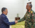 Sudan Sovereign Council chairman Abdel Fattah al-Burhan shakes hand with Nabil Fahmy Arab League SG on Oct 26, 2026