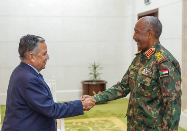 Sudan Sovereign Council chairman Abdel Fattah al-Burhan shakes hand with Nabil Fahmy Arab League SG on Oct 26, 2026