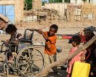 Sudanese children play on a street in Tokar, in Red Sea State, following heavy flooding in October, 2024 , AFP file photo