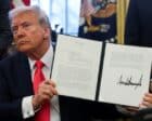 U.S. President Donald Trump holds an executive order signed in the Oval Office, at the White House in Washington, D.C., U.S. February 25, 2025. Reuters photo