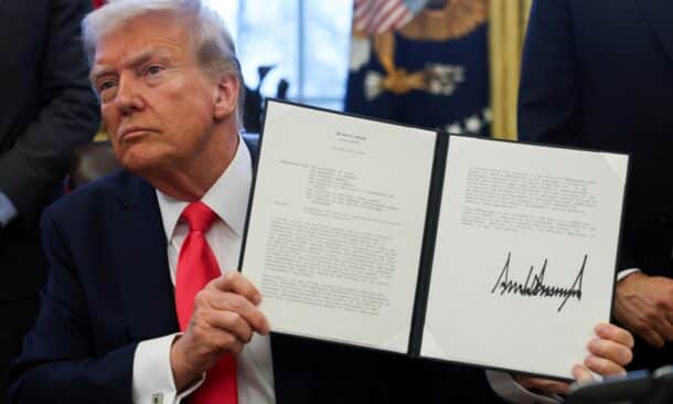 U.S. President Donald Trump holds an executive order signed in the Oval Office, at the White House in Washington, D.C., U.S. February 25, 2025. Reuters photo